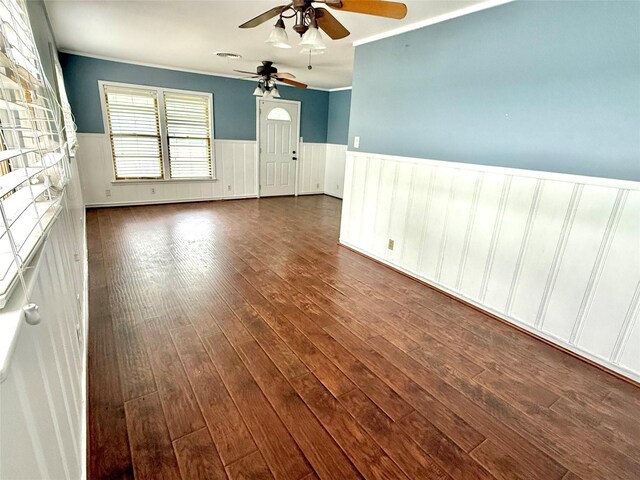 407 W Westhill Dr, Cleburne, TX 76033 - unfurnished room featuring dark wood-style floors, wainscoting, ceiling fan, and crown molding