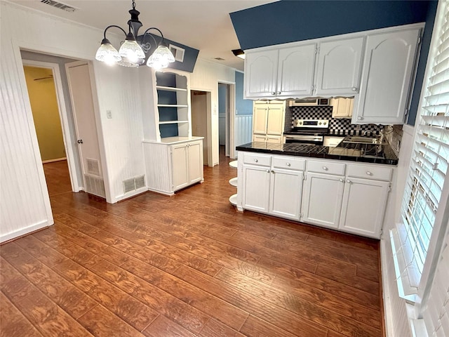 407 W Westhill Dr, Cleburne, TX 76033 - kitchen with dark wood-type flooring, white cabinetry, electric stove, and tasteful backsplash