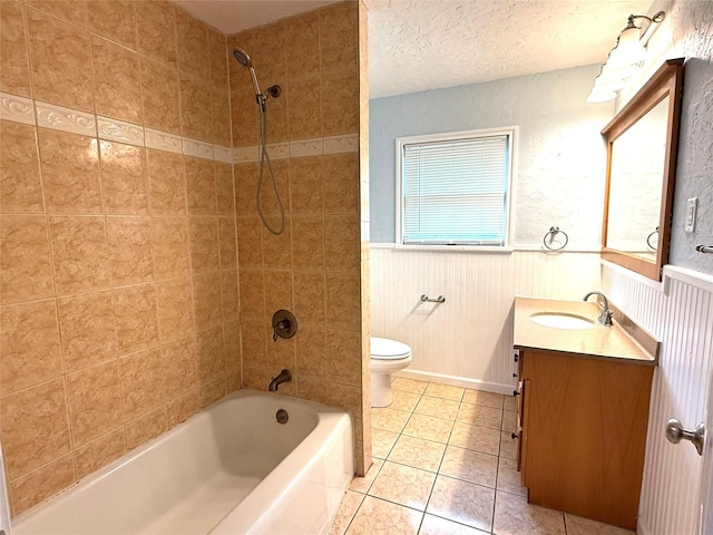 407 W Westhill Dr, Cleburne, TX 76033 - full bathroom featuring vanity, tile patterned floors, toilet, a wainscoted wall, and  shower combination