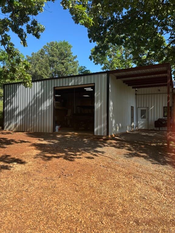 450 Vz County Road 4814, Ben Wheeler, TX 75754 - view of outdoor structure featuring an outbuilding and driveway