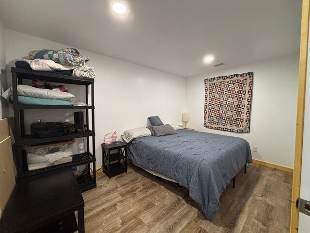 450 Vz County Road 4814, Ben Wheeler, TX 75754 - bedroom featuring wood finished floors, visible vents, and baseboards