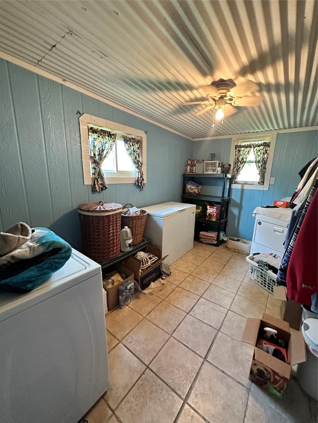 laundry area featuring washer / dryer, ceiling fan, and light tile patterned floors