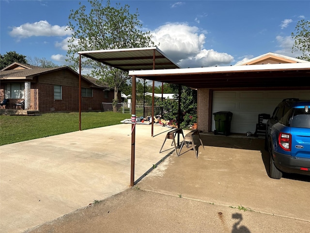 view of car parking featuring a carport, an attached garage, fence, and concrete driveway