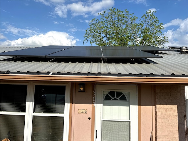 exterior space featuring metal roof