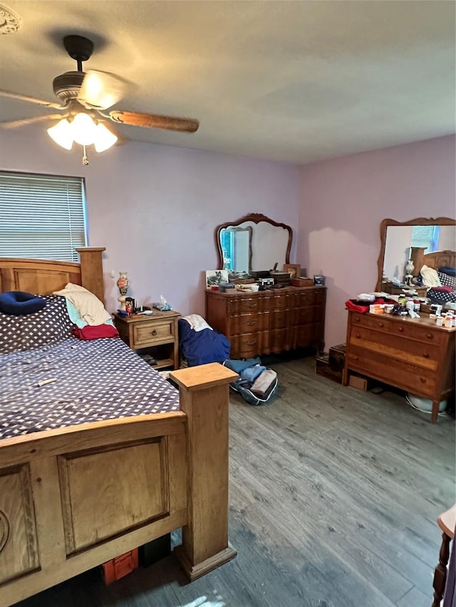 bedroom with wood finished floors and ceiling fan