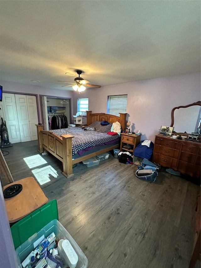 bedroom with ceiling fan and wood finished floors