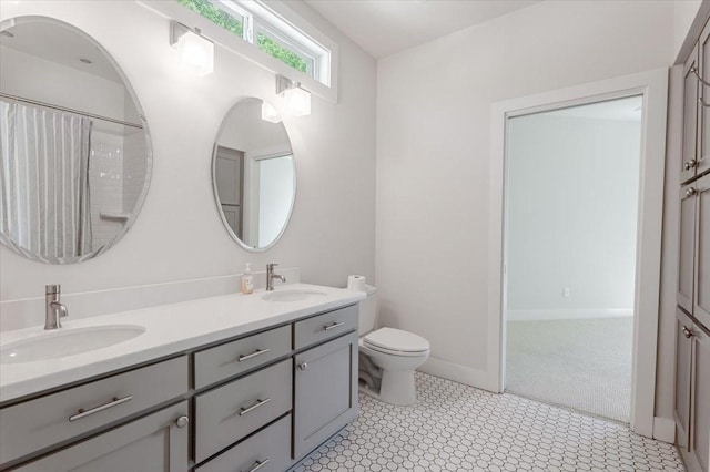 3813 Mattison Ave, Fort Worth, TX 76107 - bathroom featuring double vanity and toilet