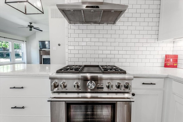 3813 Mattison Ave, Fort Worth, TX 76107 - kitchen featuring stainless steel range, exhaust hood, backsplash, a ceiling fan, and lofted ceiling