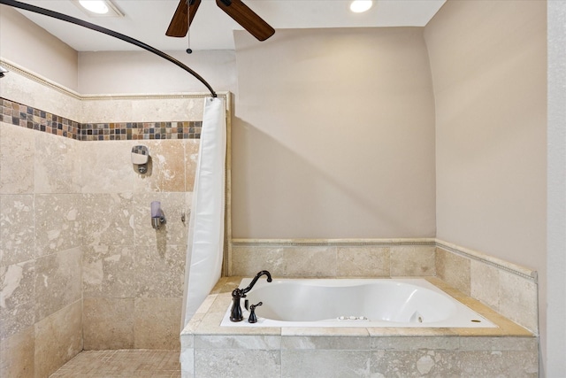 bathroom featuring a garden tub, ceiling fan, and a tile shower
