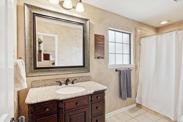 full bathroom featuring baseboards, a shower with curtain, vanity, and tile patterned floors