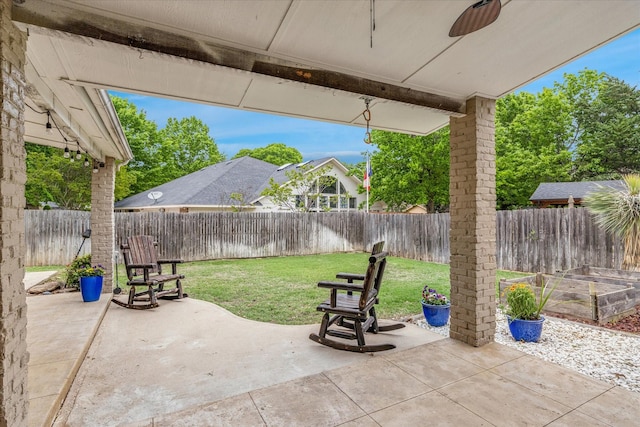 view of patio / terrace featuring a fenced backyard and a ceiling fan