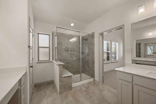 full bath with tile patterned floors, a stall shower, vanity, baseboards, and recessed lighting