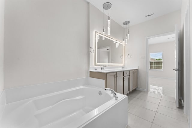 full bathroom with a bath, tile patterned floors, a sink, double vanity, and visible vents