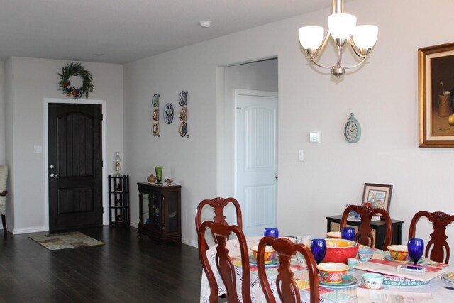 2267 County Road 4010, Decatur, TX 76234 - dining area with a chandelier, wood finished floors, and baseboards
