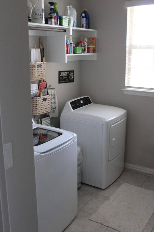 2267 County Road 4010, Decatur, TX 76234 - laundry room featuring washing machine and dryer and light tile patterned floors