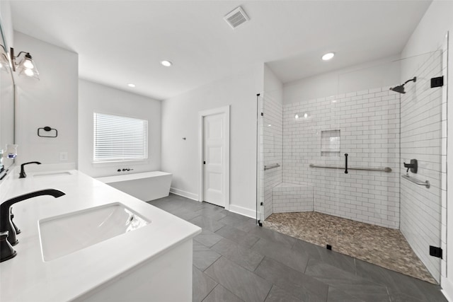 full bathroom with visible vents, a sink, and a stall shower