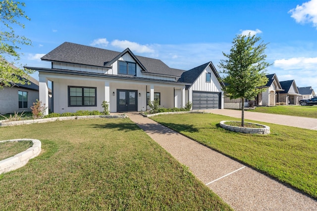 view of front of house with french doors, roof with shingles, a front lawn, driveway, and board and batten siding
