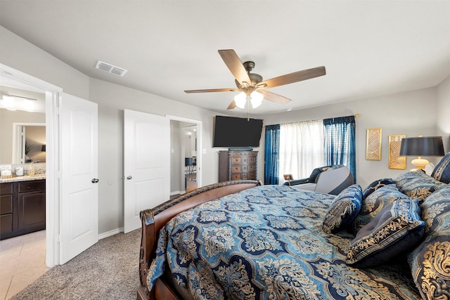 bedroom with visible vents, baseboards, and ceiling fan