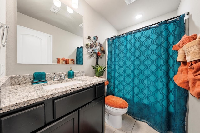 bathroom with vanity, toilet, a shower with curtain, and tile patterned flooring