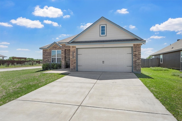 view of front facade with fence, roof with shingles, concrete driveway, brick siding, and a front yard