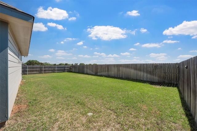 view of yard with a fenced backyard