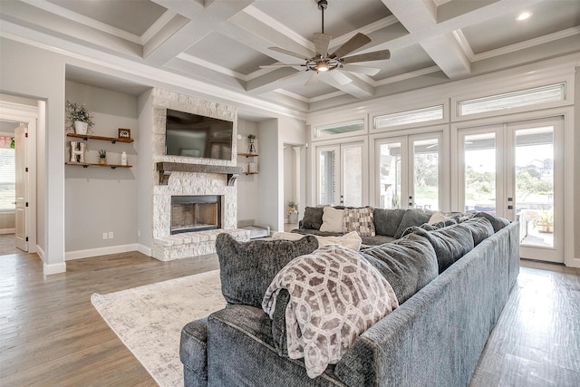 2161 Eagles Ridge Dr, Weatherford, TX 76087 - living room with light wood-style flooring, french doors, coffered ceiling, baseboards, and ceiling fan