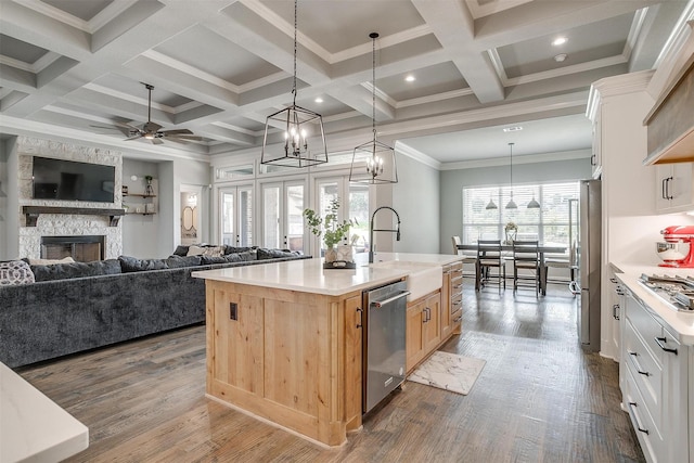 2161 Eagles Ridge Dr, Weatherford, TX 76087 - kitchen with a sink, coffered ceiling, stainless steel appliances, a fireplace, and open floor plan
