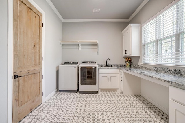 2161 Eagles Ridge Dr, Weatherford, TX 76087 - laundry room with light floors, independent washer and dryer, ornamental molding, a sink, and cabinet space