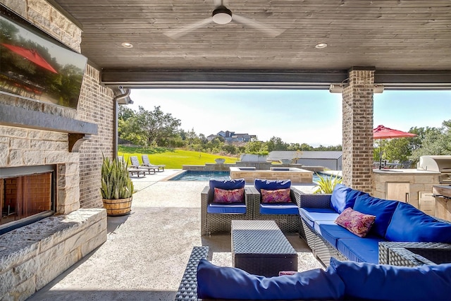 2161 Eagles Ridge Dr, Weatherford, TX 76087 - view of patio / terrace featuring an outdoor pool, grilling area, ceiling fan, an outdoor living space with a fireplace, and an outdoor kitchen