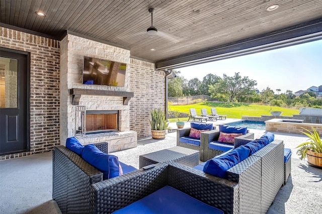 2161 Eagles Ridge Dr, Weatherford, TX 76087 - view of patio featuring an outdoor living space with a fireplace and a ceiling fan