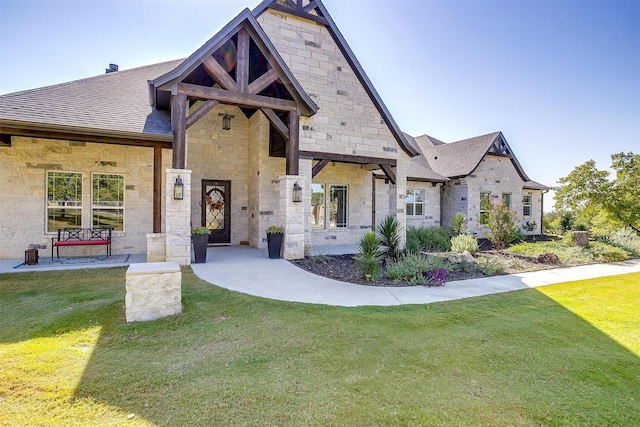 2161 Eagles Ridge Dr, Weatherford, TX 76087 - view of front of property with stone siding, a shingled roof, and a front yard
