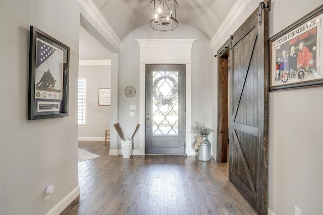 2161 Eagles Ridge Dr, Weatherford, TX 76087 - foyer with wood finished floors, plenty of natural light, a barn door, and baseboards