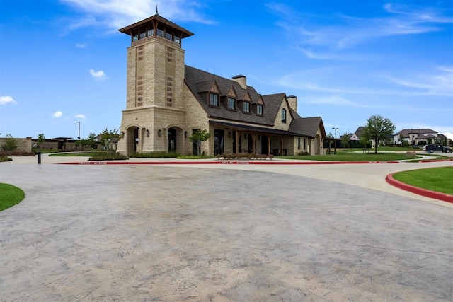 view of property featuring uncovered parking