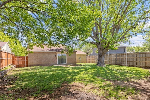 view of yard with a fenced backyard