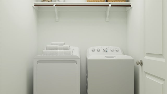 washroom featuring independent washer and dryer and laundry area