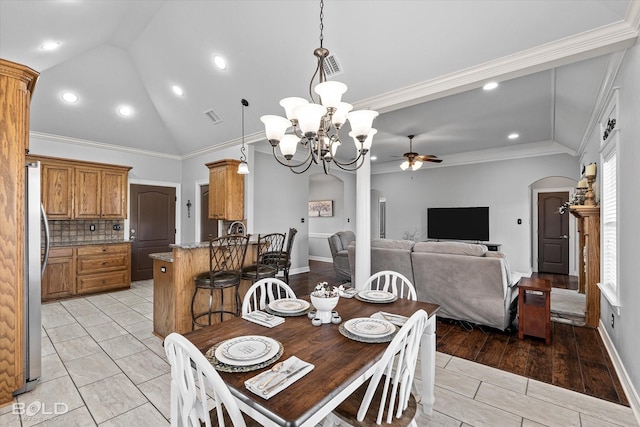 140 Fitzwilliam St, Haughton, LA 71037 - dining room featuring visible vents, arched walkways, ceiling fan with notable chandelier, and vaulted ceiling