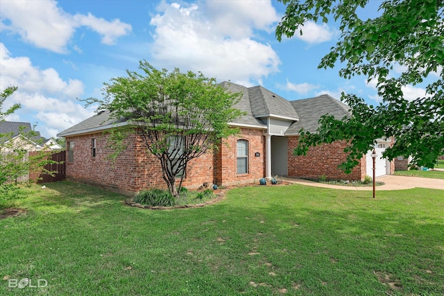 140 Fitzwilliam St, Haughton, LA 71037 - ranch-style house featuring concrete driveway, a front yard, an attached garage, fence, and brick siding