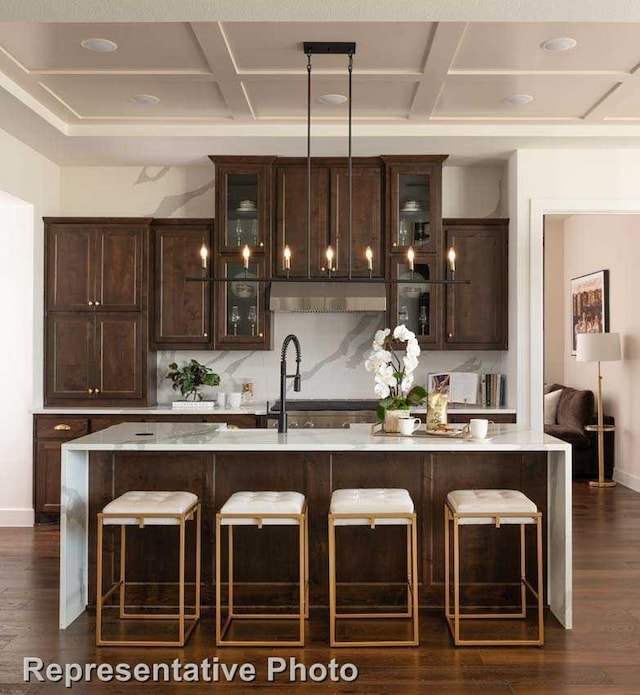 14509 Capridge Rd, Aledo, TX 76008 - bar featuring dark wood finished floors, baseboards, under cabinet range hood, and coffered ceiling