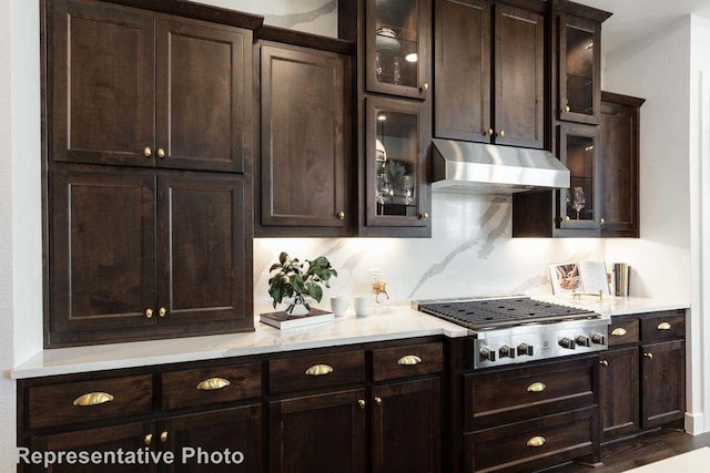 14509 Capridge Rd, Aledo, TX 76008 - kitchen featuring light countertops, stainless steel gas cooktop, dark brown cabinetry, and under cabinet range hood