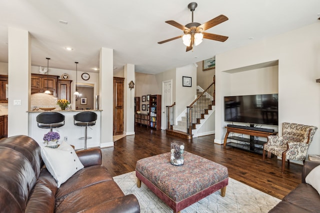 living room featuring stairway, wood finished floors, ceiling fan, baseboards, and recessed lighting