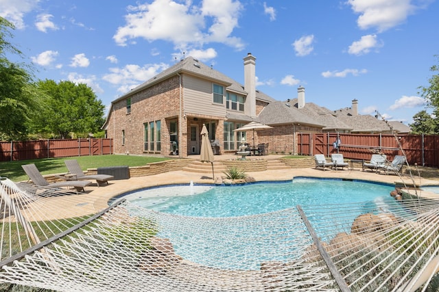 view of pool featuring a fenced backyard, a patio area, and a fenced in pool