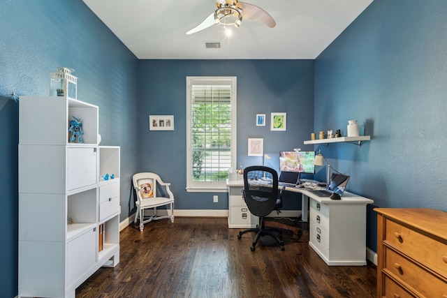office space featuring baseboards, a ceiling fan, dark wood-type flooring, and visible vents