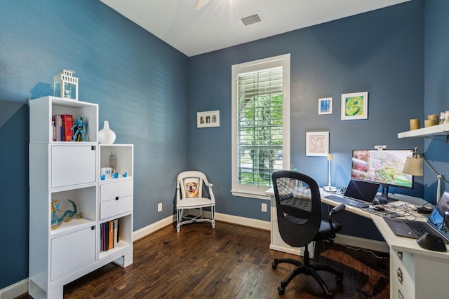 office space with ceiling fan, visible vents, baseboards, and dark wood-style flooring