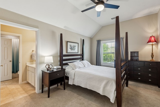 bedroom featuring ensuite bath, ceiling fan, lofted ceiling, and visible vents