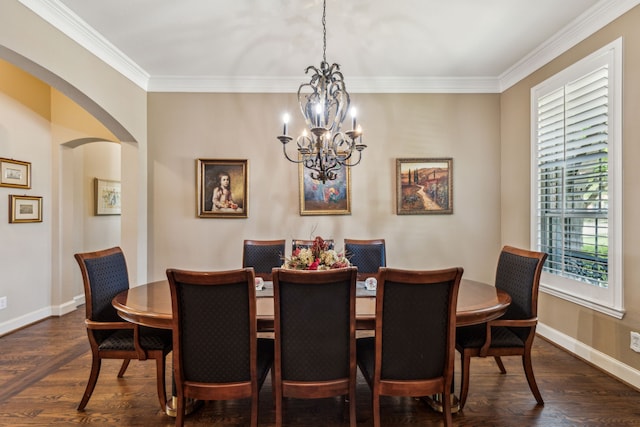 dining area with ornamental molding, arched walkways, and dark wood-style flooring