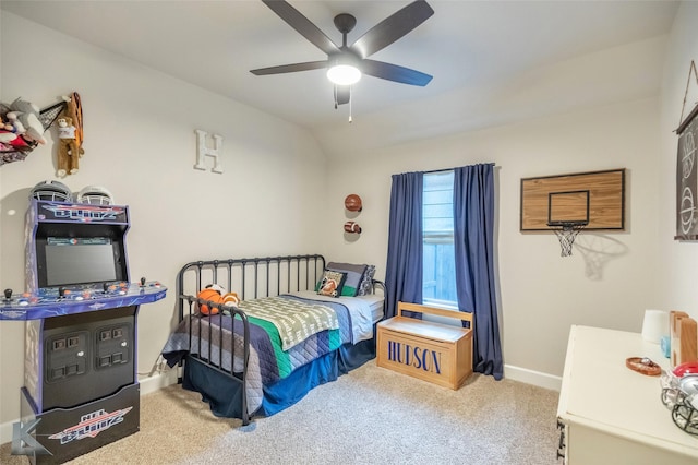 carpeted bedroom featuring baseboards and ceiling fan