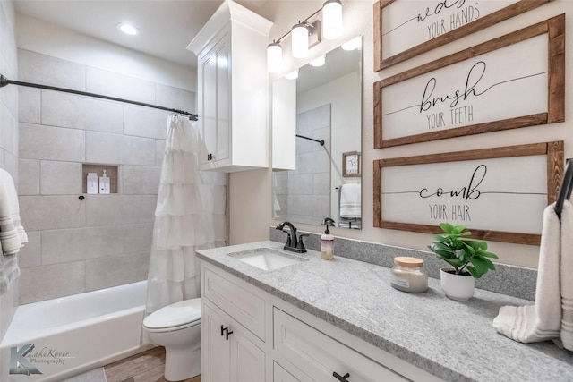 full bathroom with toilet, recessed lighting, shower / tub combo, wood finished floors, and vanity