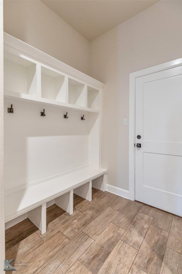mudroom with light wood-type flooring and baseboards