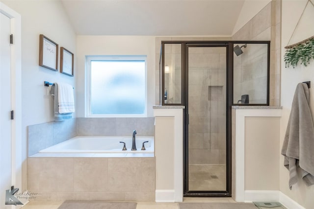 full bathroom featuring a shower stall, vaulted ceiling, a bath, and visible vents
