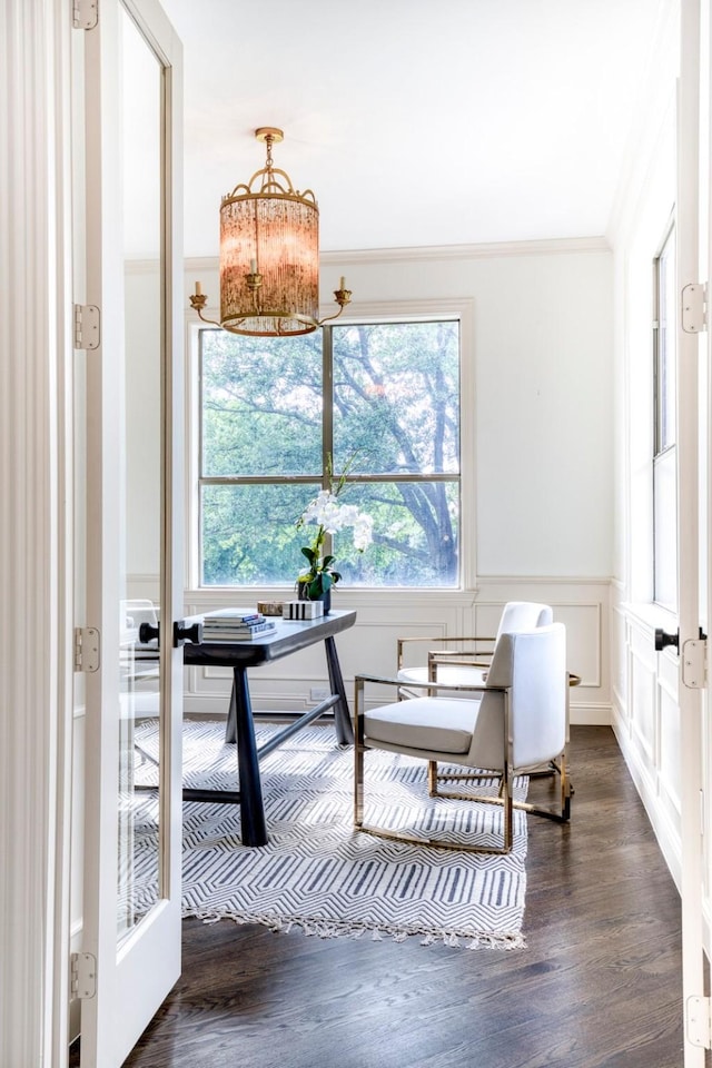 home office with a chandelier, wainscoting, dark wood-style flooring, and crown molding